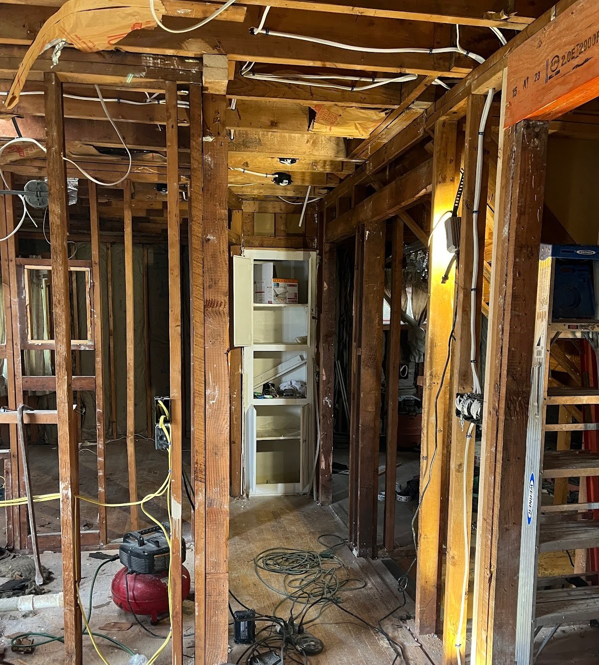 A home made of wood, full of mess, being repaired in Massachusetts